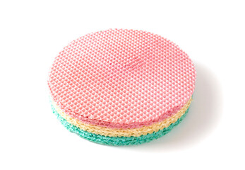 Multicolored waffle cake on a white plate, isolate. Close-up, sweet food