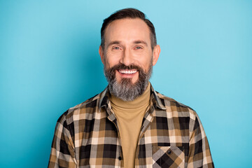 Photo of satisfied person toothy smile look camera wear checkered outfit isolated on blue color background