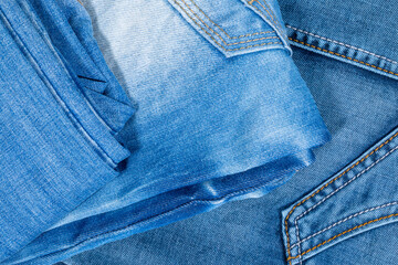 Fototapeta premium Photo of denim pants from above. Background on the theme of denim clothing.