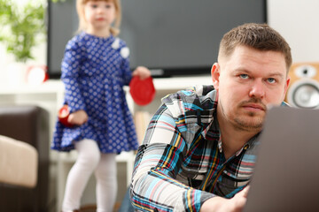 Fototapeta premium Cute little girl watch out furtively for her dad