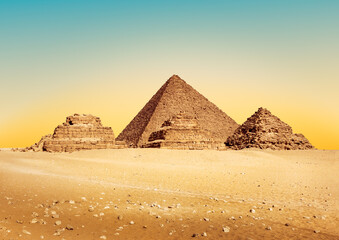 Egypt Pyramids in Giza at sunset. Tomb of the pharaoh Menkaure, Mykerinos or Menkheres with small...