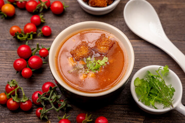 Homemade tomato soup with tomatoes, herbs and spices