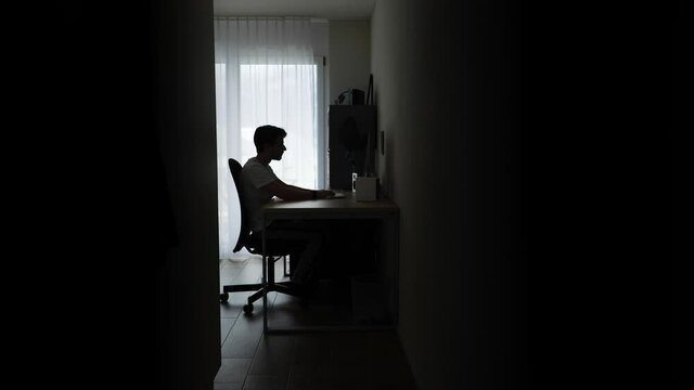 Overworked business man waking up and continues to work at home.