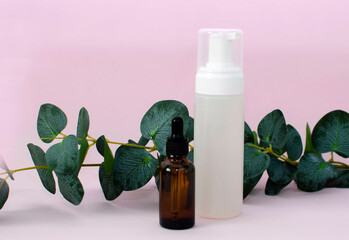 Tubes of serum or other cosmetics. Serums and natural oil droppers. Space for the text