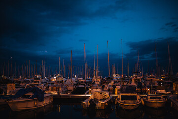 marina in night, view on the city with boats