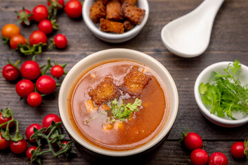 Homemade tomato soup with tomatoes, herbs and spices