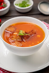 Homemade tomato soup with tomatoes, herbs and spices