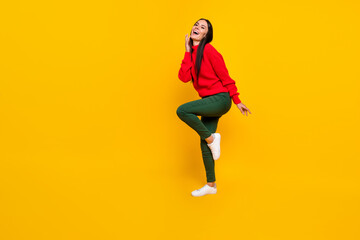 Fototapeta na wymiar Full size photo of young happy funky funny smiling excited woman look copyspace dancing isolated on yellow color background