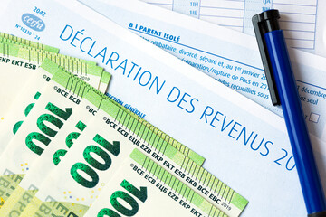 French Declaration des revenus 2020 income tax paper form and Euro bills