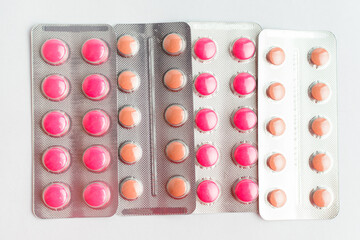 Many medicine pills, tablets and vitamins isolated on white background, pharmaceutical picture taken with soft focus.