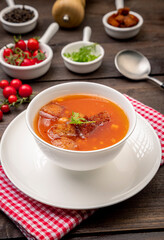 Homemade tomato soup with tomatoes, herbs and spices