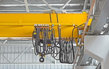 Overhead crane inside factory or warehouse. That industrial machinery or lifting equipment consist...