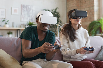 Couple happy to play video game together at home