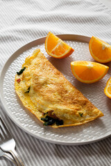 Homemade Bacon Spinach Omelette with Cheddar, side view.