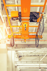 Overhead crane inside factory or warehouse. That industrial machinery or lifting equipment consist...