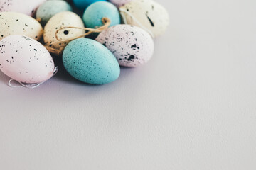 Pastel colored decorative easter eggs. White background, copy space.