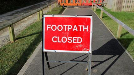 Road works, fenced off and closed footpath on a sunny day
