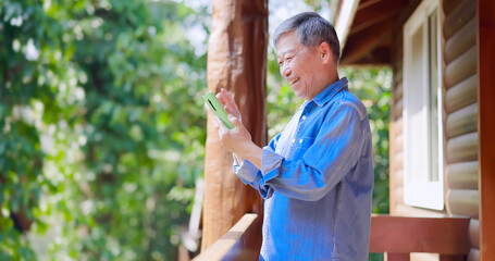 asian retired man use smartphone