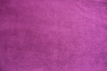 Magenta colored faux suede fabric from above