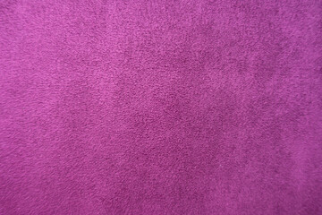 Top view of magenta colored faux suede fabric