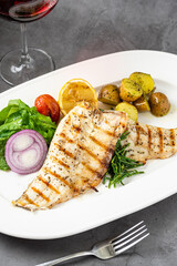 Grilled seabass fillet with garnish, seafood fish dish elegant presentation