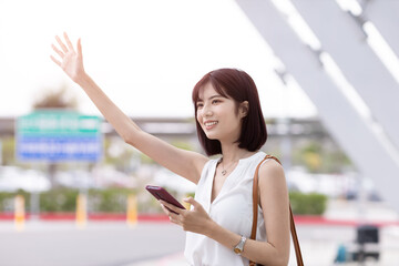 businesswoman hail a taxi