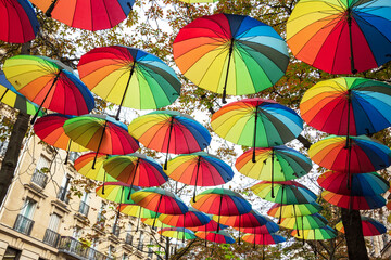 Fototapeta na wymiar Paris, France. Colorful umbrella decoration at Parisian street. Autumn vacation concept.