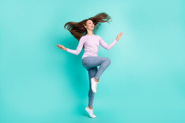 Obraz premium Full length body size view of charming cheerful girl jumping having fun good mood isolated over turquoise bright color background