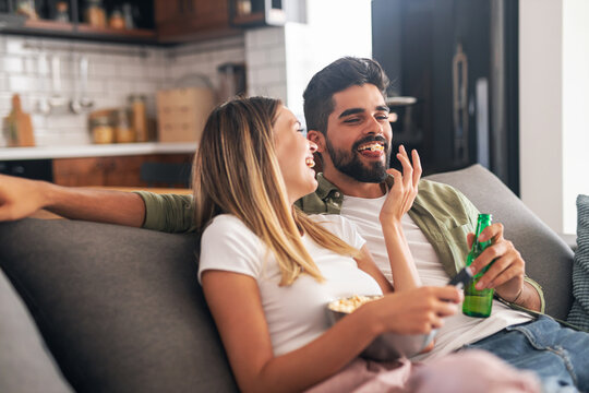 Happy couple relaxing at home