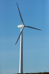 Clean electricity producing wind turbines built on a windy mountain ridge
