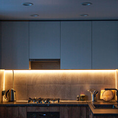 Modern kitchen interior lightning with cement wall and gas coocker
