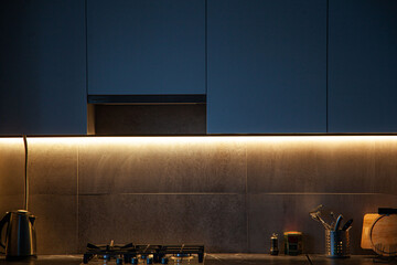 Modern kitchen interior lightning with cement wall and gas coocker