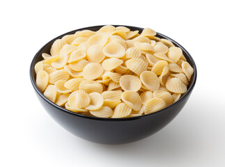 Uncooked orecchiette pasta in black bowl isolated on white background with clipping path