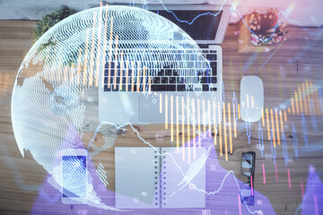 Multi exposure of financial chart drawing over table background with computer. Concept of research....