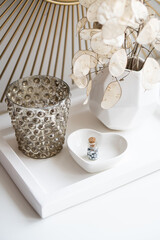 Beautiful white home interior decoration with vases and mirror