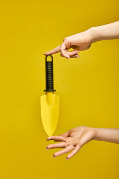 Small Shovel For Gardening Isolated On Yellow Background