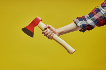 New axe isolated on yellow background