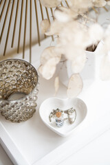 Beautiful white home interior decoration with vases and mirror