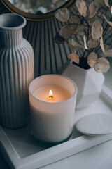 Luxurious white tray decoration, home interior decor with burning candle