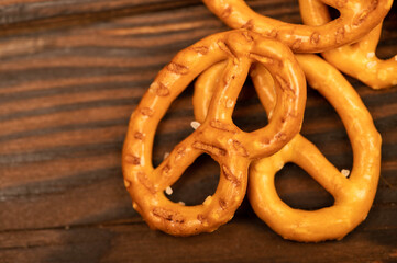 Salted breadsticks and salted pretzels scattered on the table.