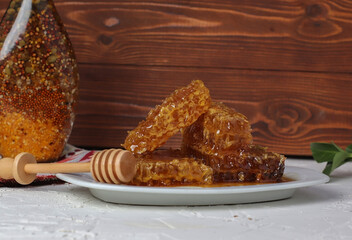 Honeycomb with honey on white background