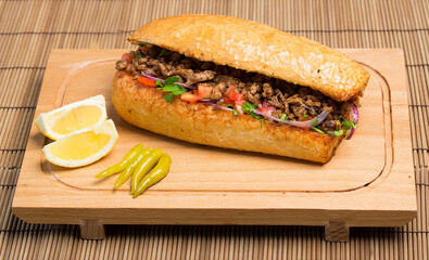 Turkish Doner Sandwich with lemon on a plate
