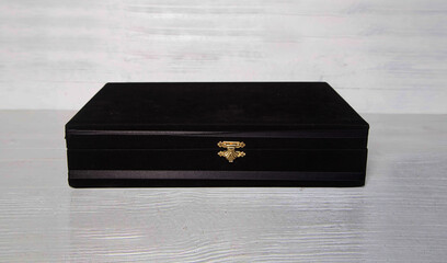 Small chest on a wooden background