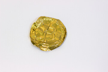 Crumpled bitcoin on white background. Fake bitcoins cryptocurrencies on white canvas, crumpled, twisted