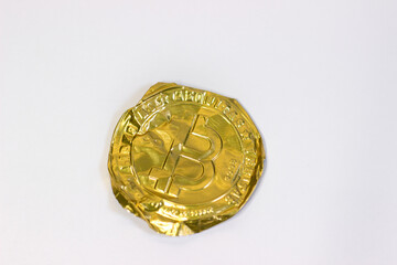 Crumpled bitcoin on white background. Fake bitcoins cryptocurrencies on white canvas, crumpled, twisted