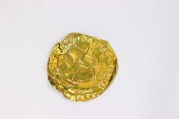 Crumpled bitcoin on white background. Fake bitcoins cryptocurrencies on white canvas, crumpled, twisted