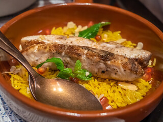 Roasted sea bass in Mediterranean style restaurant