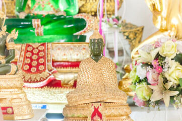 The Artificial Emerald Buddha image in rainy costume at Wat Chimphli Sutthawat temple in Ko Kret Island ,Nonthaburi temple ,Thailand