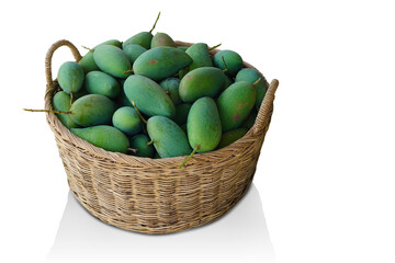 Fresh green mangos in the wooden basket on white background, fruit, food, copy space
