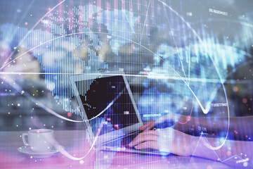 Multi exposure of woman hands typing on computer and business theme hologram drawing. Success...
